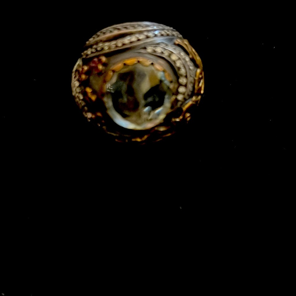 hand crafted artisan chunky gold and silver ring with stone in middle